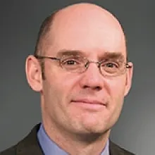 Скотт Е. Пейдж logo